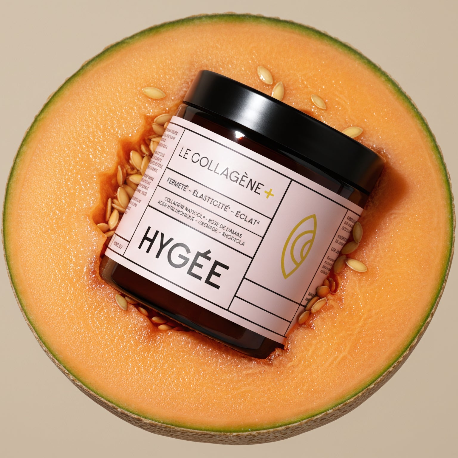 A pink‑labeled HYGÉE Le Collagène+ jar rests diagonally inside a ripe cantaloupe half with glossy seeds, set against a soft beige background in bright natural light.