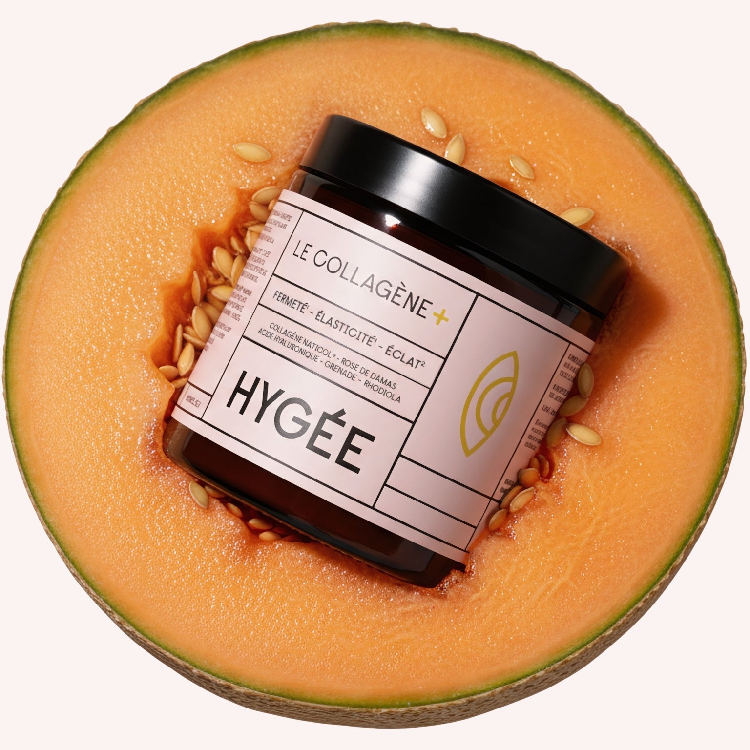 Hygée Le Collagène+ amber jar lies in the centre of a juicy orange melon half with visible seeds, visually linking the collagen supplement to antioxidant, vitamin‑rich fruit ingredients for plump, radiant skin.